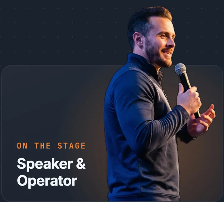 Rick Elmore speaking on stage with a microphone